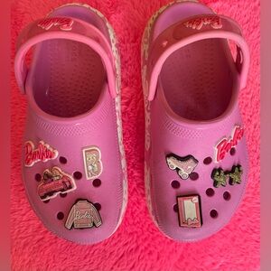 Barbie x Crocs platforms. Gently used, signs of wear shown. Size 13 little kids